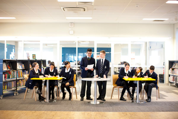 Students debating in school library at Clancy Catholic College West Hoxton